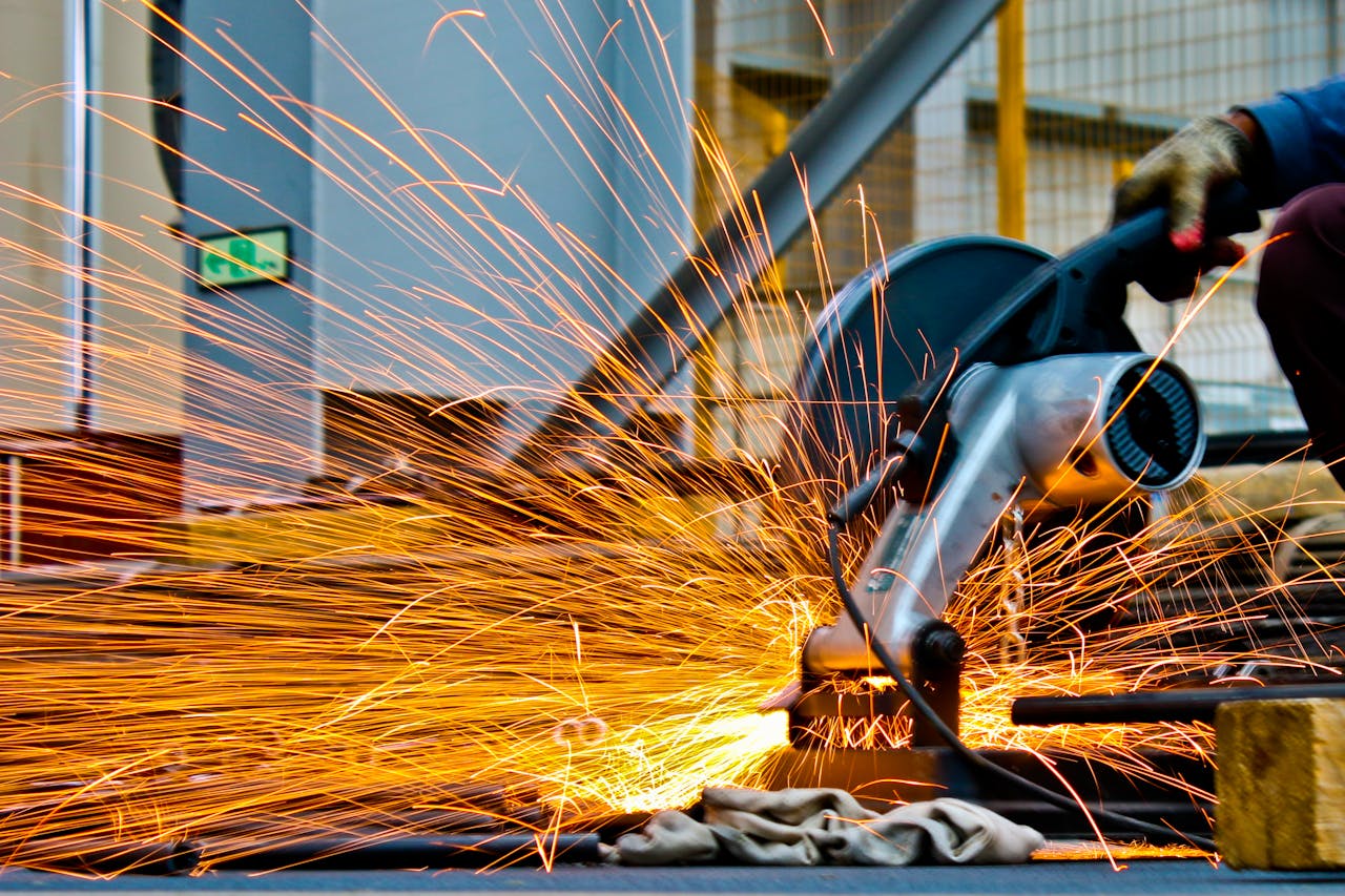 Industrial manufacturing with sparks and precision machinery